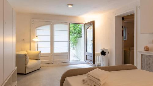a living room with a couch and a window at VILLA CORONA 8, Emma Villas in Cattolica