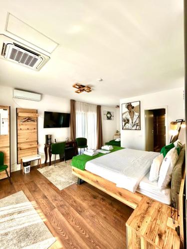 a bedroom with a large bed in a room at Hotel B4 in Oradea