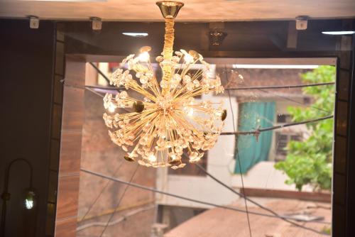 a chandelier hanging from a ceiling in a room at Radiant Inn in Morena