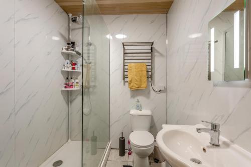 a bathroom with a shower and a toilet and a sink at 1 Bed in Tilbrook oc-a40241 in Tilbrook