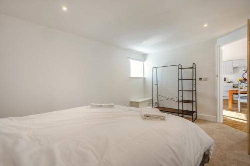 a bedroom with a white bed and a ladder at 1 Bed in Barrow oc-b42640 in Barrow