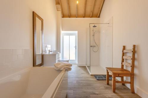 a bathroom with a tub and a shower with a mirror at 2 Bed in Barrow oc-b42642 in Barrow