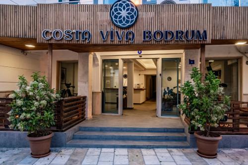 a building with a sign for a boutique at Costa Viva Bodrum in Bodrum City