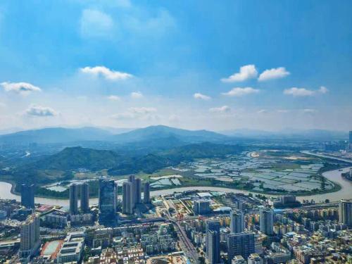 an aerial view of a city and a river at The St. Regis Shenzhen in Shenzhen