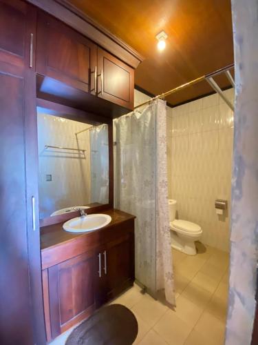 a bathroom with a sink and a toilet at Villa GHANIA in Labuanbalat