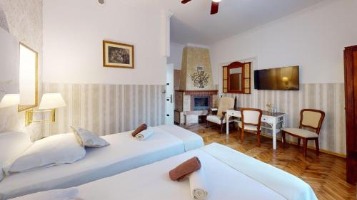 a bedroom with two beds and a living room at Śnieżka in Krosno