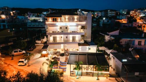 an aerial view of a building at night at Zogaj Hotel in Ksamil