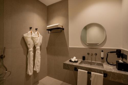 a bathroom with a sink and a mirror at TRIANON Résidence Hôteliere in Marrakesh