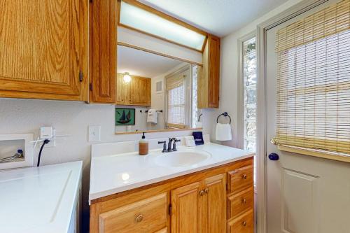 a bathroom with a sink and a mirror at Whidbey Moon Landing in Coupeville