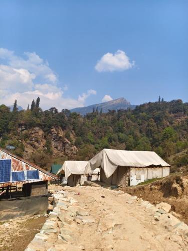 a group of tents on top of a mountain at HIMALAYAN ESCAPE CAMP chopta in Chopta