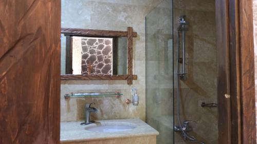 a bathroom with a sink and a shower at Dilichella Resort in Dilijan