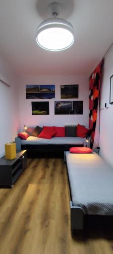 a living room with two beds in a room at Casa Vacanze isopep in Lama Di Peligni