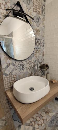 a bathroom with a white sink and a mirror at Casa Vacanze isopep in Lama Di Peligni