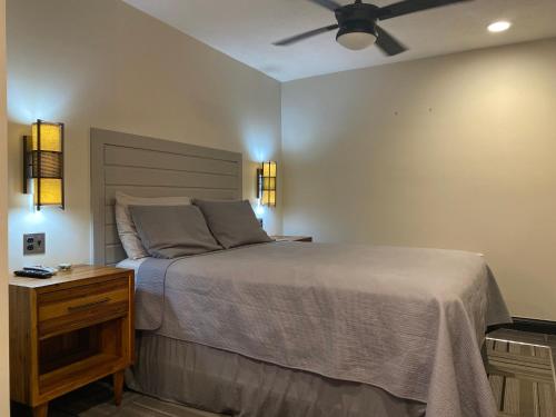 a bedroom with a bed and a ceiling fan at The Sandusky Melrose - Next to the Cedar Point Sports Center and Sports Force! Recently Renovated! in Sandusky