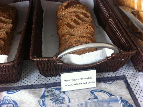a loaf of bread in a basket with a sign at The Hyperion Boutique Hotel in Florianópolis