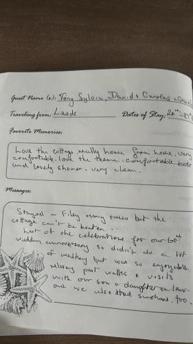 a handwritten letter with handwriting on a sheet of paper at Murray's Lodge in Filey