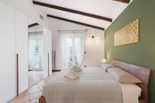 a bedroom with a large bed in a room at Cà da Trûcca in Varazze