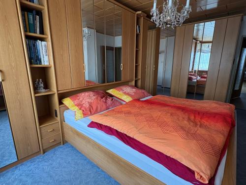 a bedroom with a bed and a large mirror at Villa Margot in Schrems