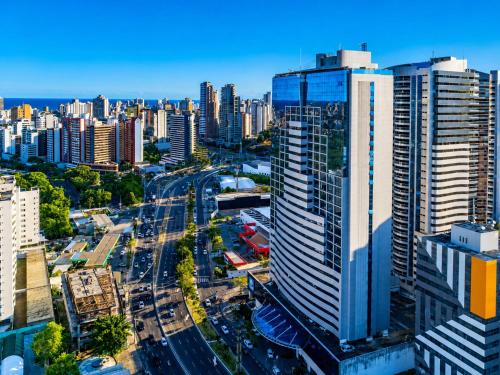 an aerial view of a city with tall buildings at Intercity Salvador in Salvador