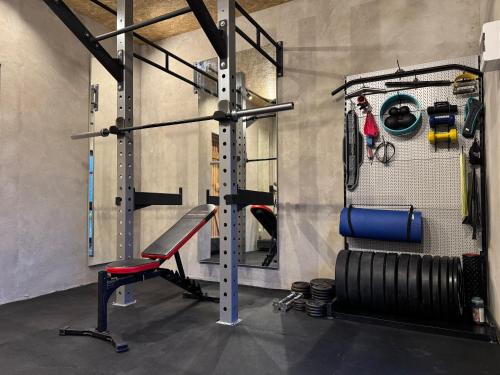 a gym with a punching bag and a bench at Galeria PRL in Borne Sulinowo