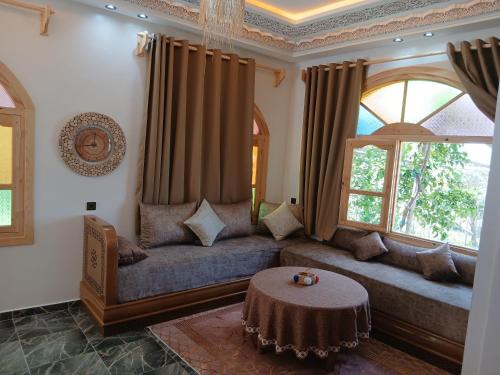 a living room with a couch and a table at Blue House Town in Chefchaouen