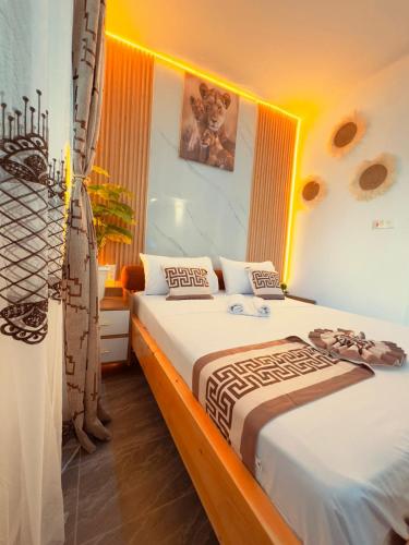a bedroom with a large bed in a room at Homes by Najma in Mtwapa