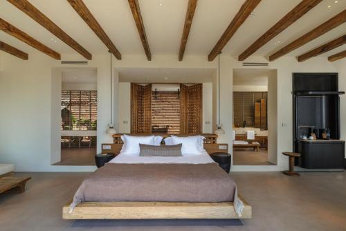 a bedroom with a large bed in a room at Klay Hotel Faralya Adults Only in Faralya