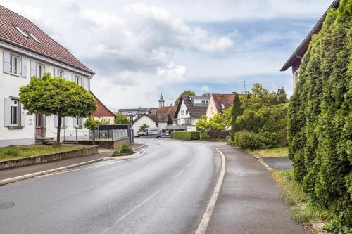 an empty street in a village with houses at Fewo Fürst in Moos
