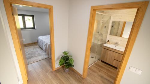 a bathroom with a sink and a mirror at Casa da Moura - Arcos de Valdevez in Arcos de Valdevez