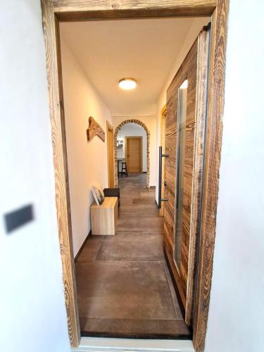 a hallway of a home with wooden floors and a door at Casa Bassanello in Candide