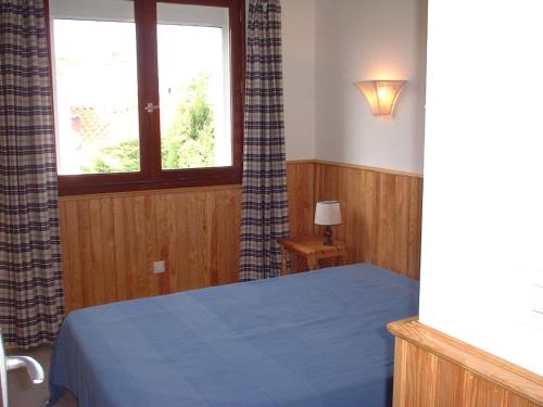 Tempat tidur dalam kamar di Residence la Catalane
