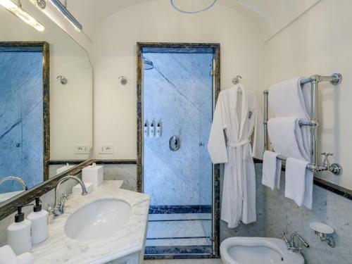 a bathroom with a sink and a shower at Hotel du Tasso Sorrento in Sorrento
