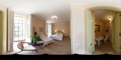 two pictures of a room with a bed and a bathroom at Hostal Fornos in Segovia