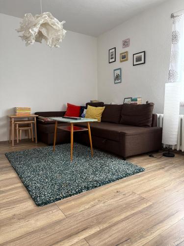 a living room with a couch and a table at Vergissmeinnicht - Das Haus in Kurort Oberwiesenthal