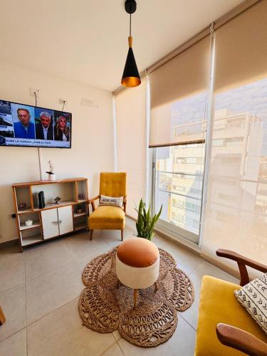 a living room with a couch and a chair at Los Pirineos TC in Junín