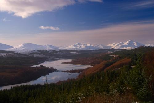 a view of a river with snow capped mountains at Corriegour Lodge Hotel in Spean Bridge