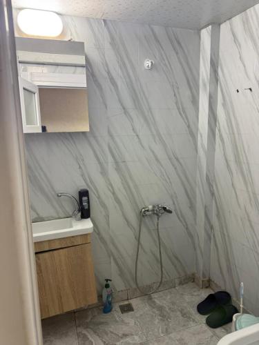 a bathroom with a shower and a sink at Sunrise Hotel in Antalya