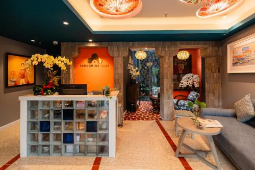 a store with a couch and a table in a room at Indochine Casa Hotel in Ho Chi Minh City