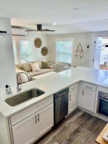 a kitchen with a sink and a counter top at Lil' Beach Getaway in Jacksonville Beach