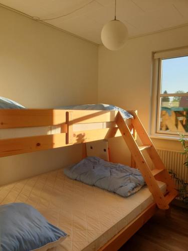 Llit o llits en una habitació de Jelling hus