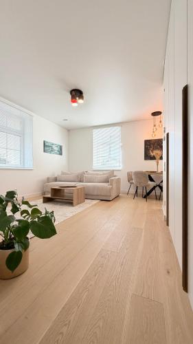 a living room with a couch and a table at Apartamentai Trakų centre in Trakai