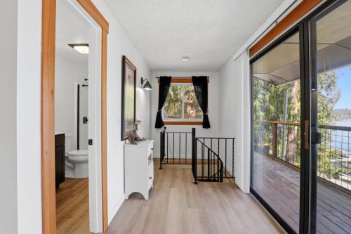 a bathroom with a toilet and a window at Hayden Lake Oasis in Hayden