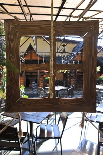 a mirror hanging from the ceiling of a restaurant at Туристично розважальний комплекс "Стіжок" in Berehomet