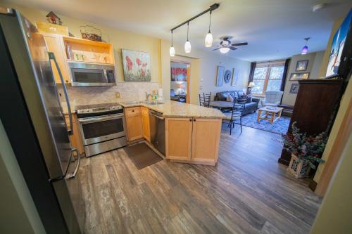 a kitchen with a refrigerator and a counter top at Silver Mill 8228 by SummitCove Lodging in Colorado in Keystone