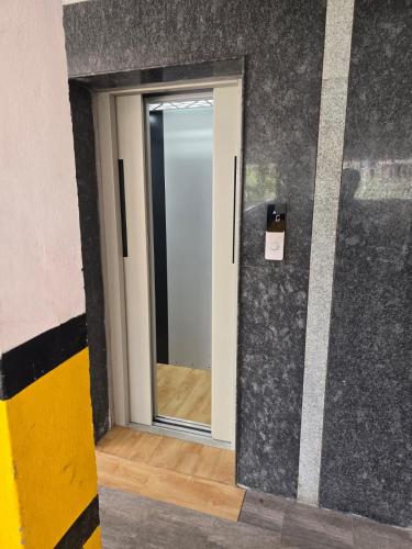 a door with a mirror in a room at Peelamedu PSG Tech Near Rooms in Coimbatore