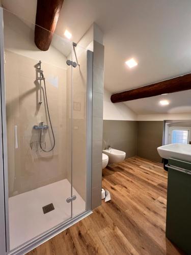 a bathroom with a shower and a sink at B&Bee alla corte in Dossobuono
