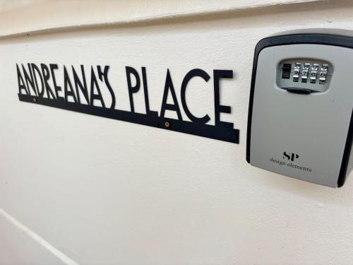 a black and white sign on a wall with a mailbox at Andreana's Place Rhodes in Asgourou