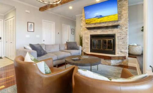 a living room with a couch and a fireplace at Emerald Bay Unit 1B in Lake Ozark