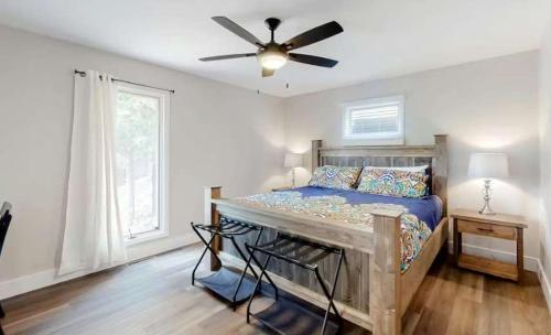 a bedroom with a bed and a ceiling fan at Lake Ozarks in Rocky Mount