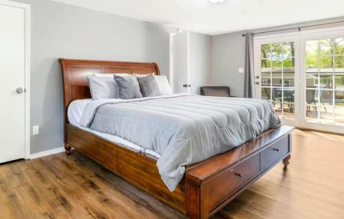 a bedroom with a large bed with a wooden frame at Eternal Sunrises in Sunrise Beach